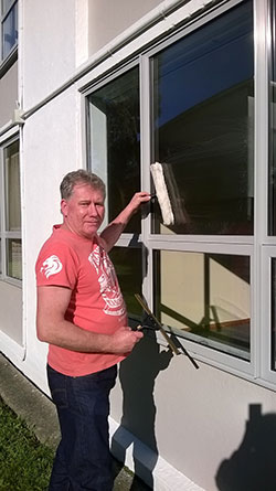 John the Window Cleaner with a brush