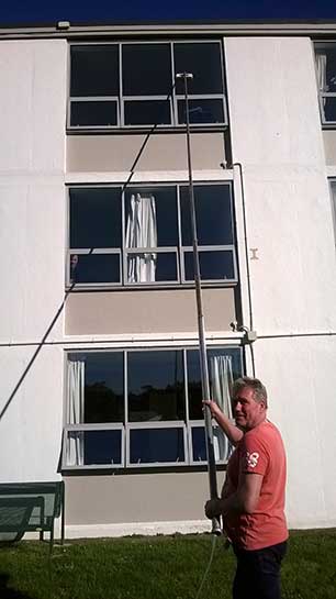 John the Window Cleaner with long pole facing camera