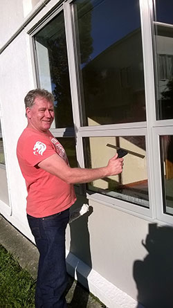 John the Window Cleaner with a squeegee